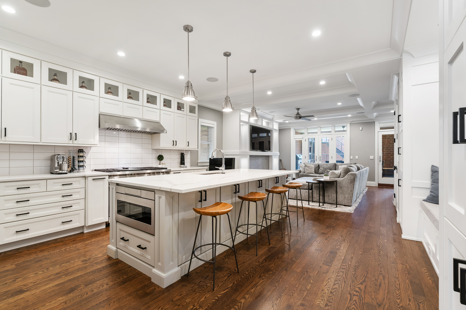 729 West Barry Avenue, Unit 1 Chicago, IL 60657 - Photo 6 of 34 a kitchen with stainless steel appliances granite countertop a stove and a wooden floors