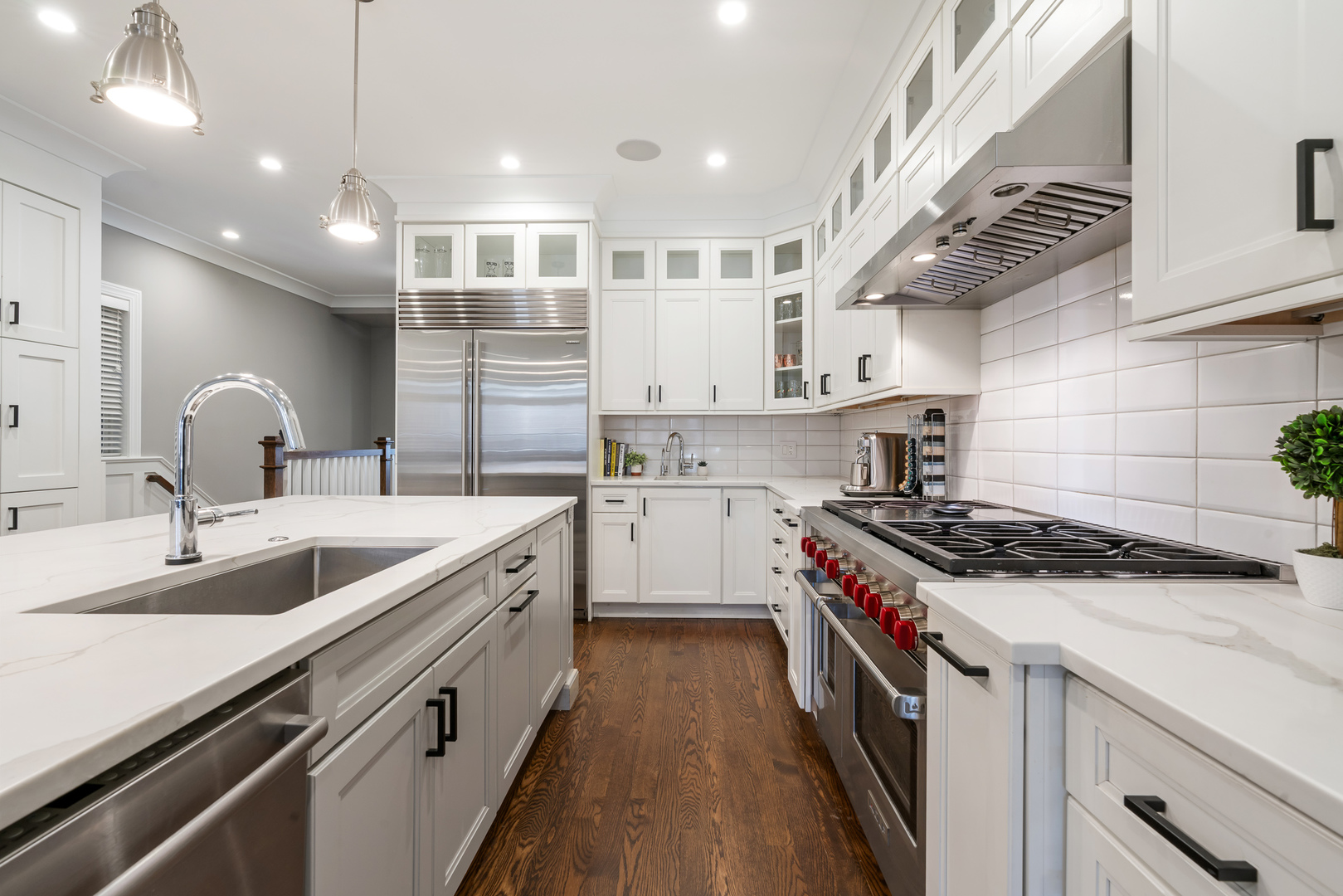 729 West Barry Avenue, Unit 1 Chicago, IL 60657 - Photo 7 of 34 a kitchen with kitchen island a sink stainless steel appliances and a counter space