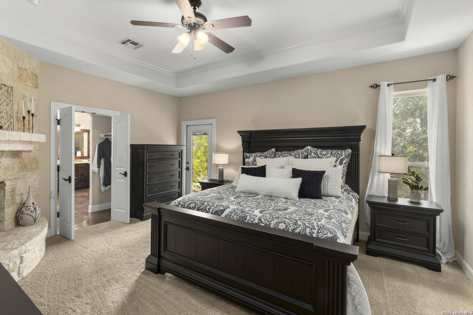 786 Shepherd's Crook Helotes, TX 78023 - Photo 15 of 36 a bedroom with a bed and a chandelier