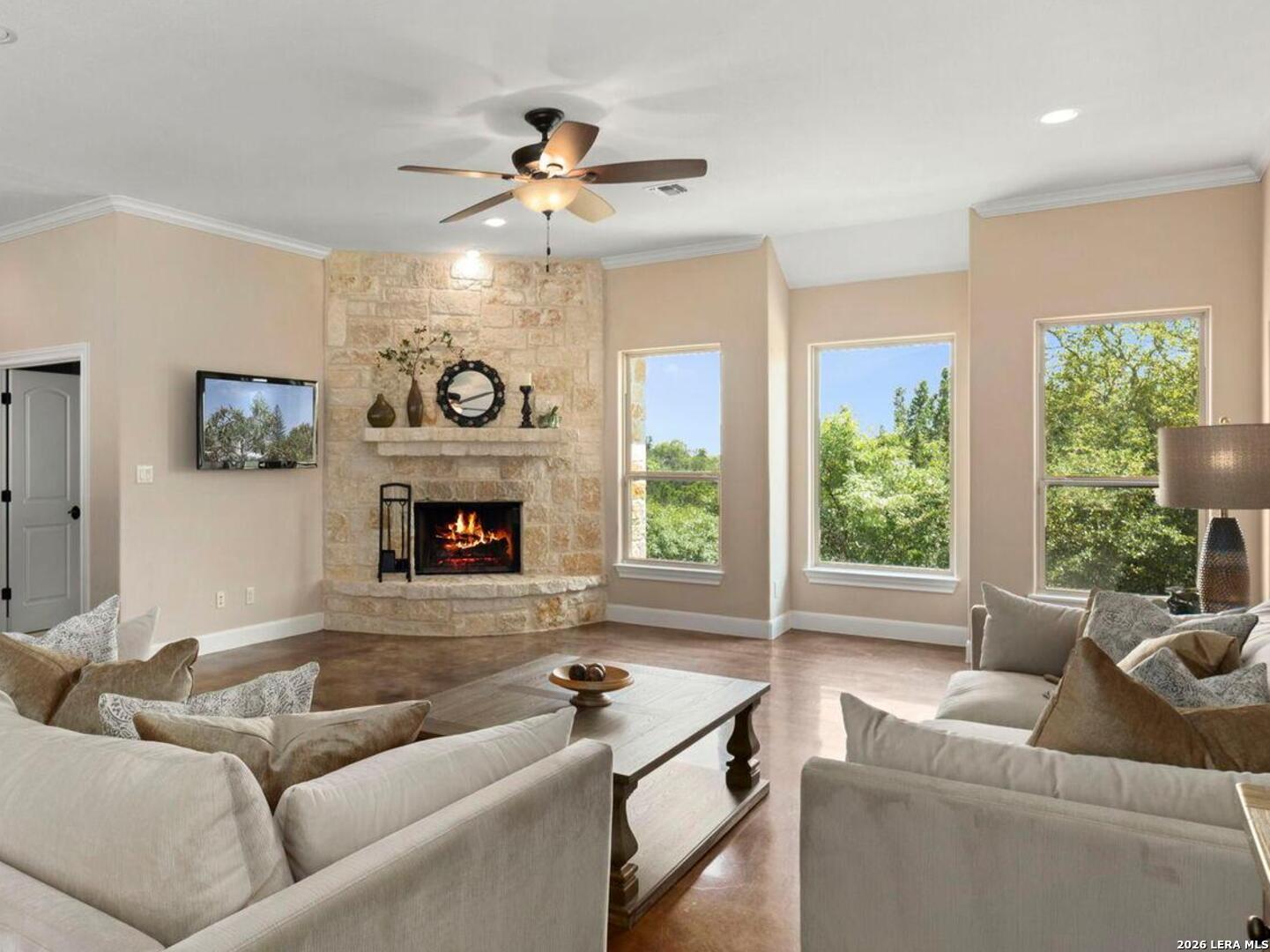 786 Shepherd's Crook Helotes, TX 78023 - Photo 5 of 36 a living room with furniture and a fireplace