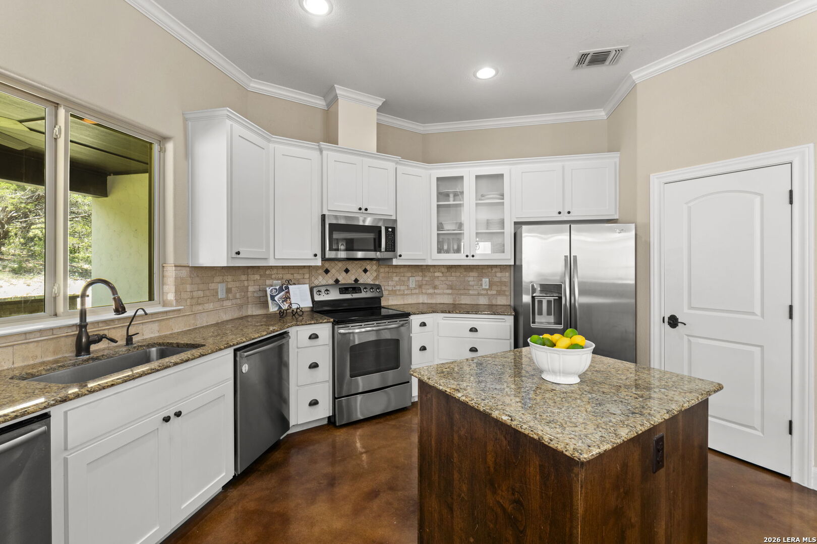 786 Shepherd's Crook Helotes, TX 78023 - Photo 7 of 36 a kitchen with a sink a stove and cabinets