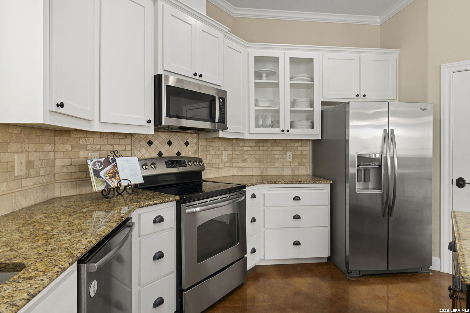 786 Shepherd's Crook Helotes, TX 78023 - Photo 8 of 36 a kitchen with stainless steel appliances granite countertop a sink stove and refrigerator