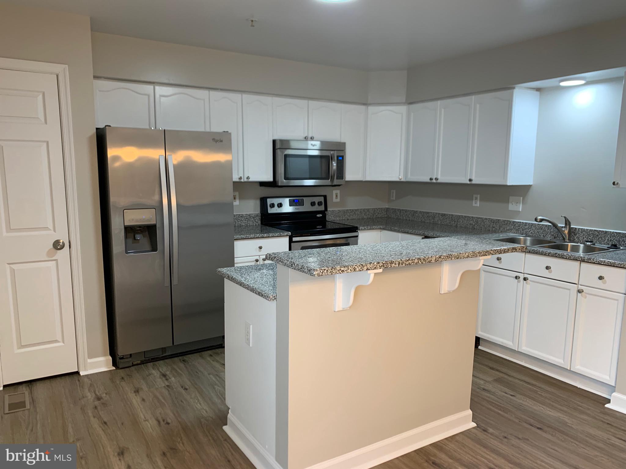 114 Sentry Ridge Smithsburg, MD 21783 - Photo 11 of 60 a kitchen with a refrigerator sink and microwave