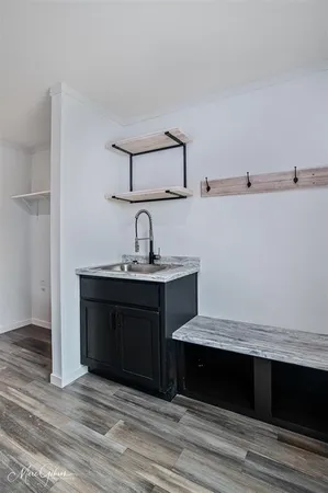 a room with a mirror and a sink