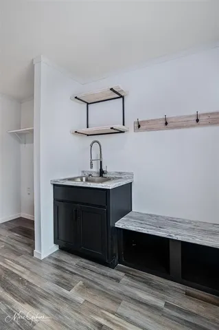 a room with a mirror and a sink