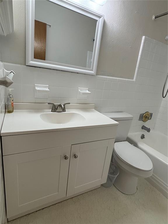 1102 Sunset Point Road, Unit 6 Clearwater, FL 33755 - Photo 20 of 31 a bathroom with a sink toilet and mirror
