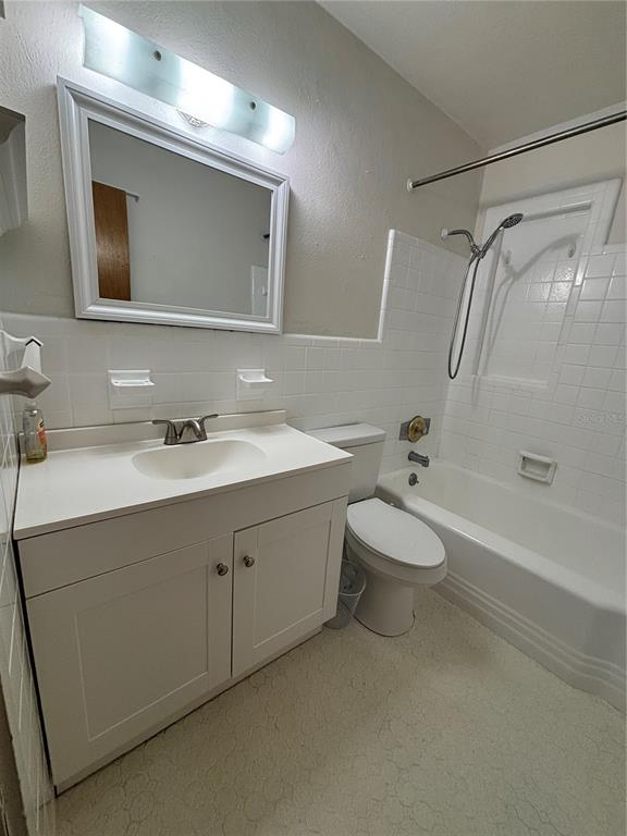 1102 Sunset Point Road, Unit 6 Clearwater, FL 33755 - Photo 21 of 31 a bathroom with a double vanity sink mirror and toilet