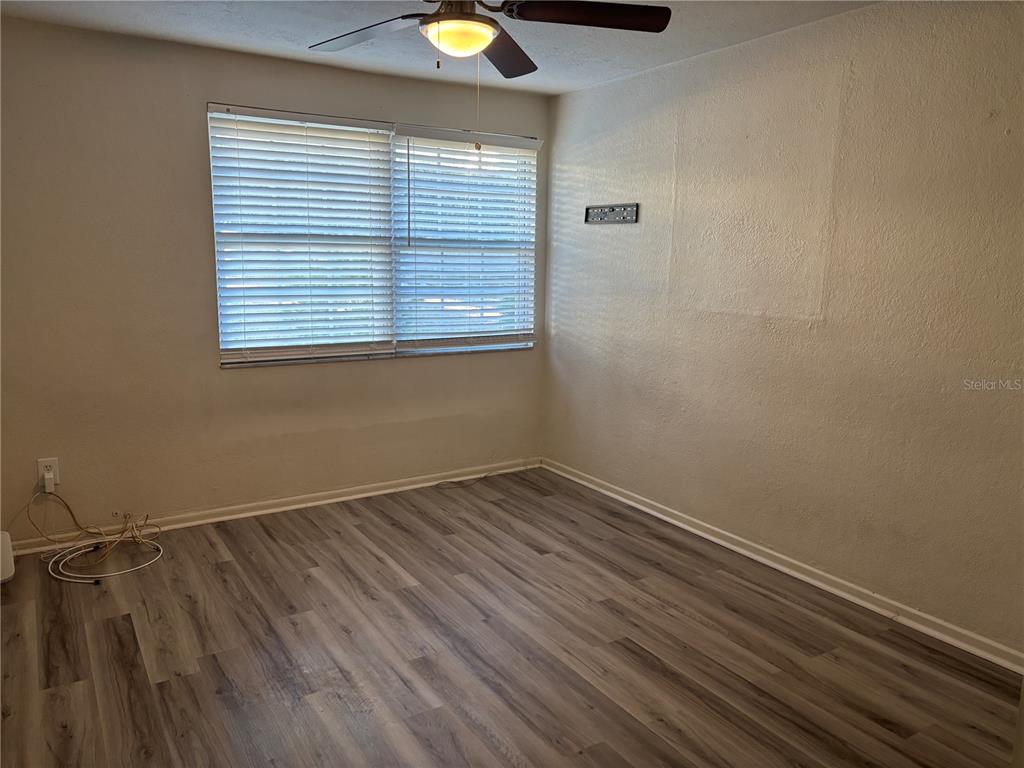 1102 Sunset Point Road, Unit 6 Clearwater, FL 33755 - Photo 22 of 31 an empty room with a window