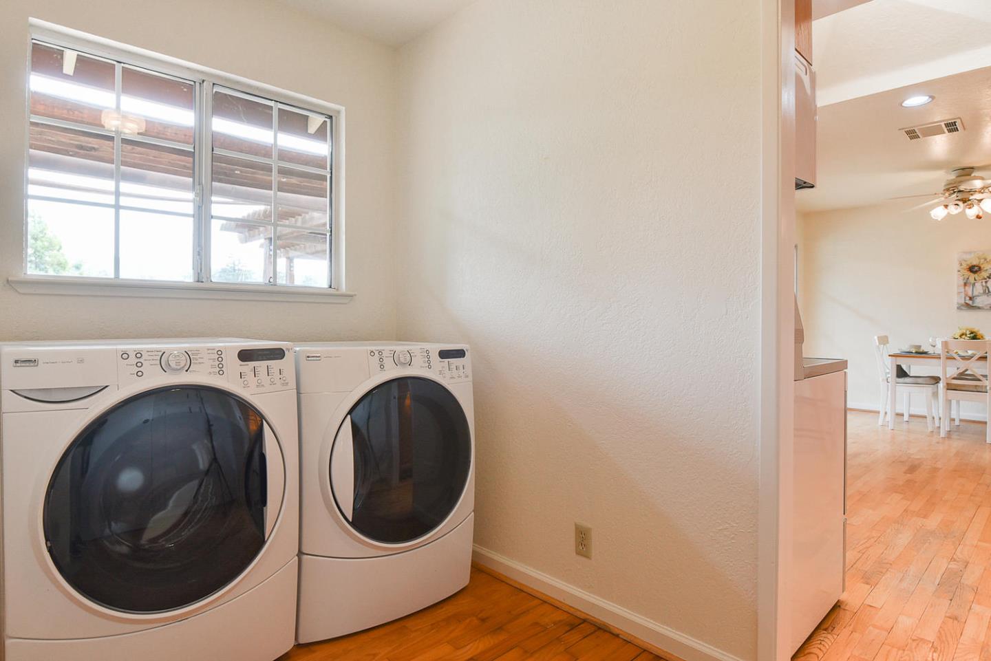 9235 Burchell Road Gilroy, CA 95020 - Photo 18 of 29 a view of a hallway with washer and dryer