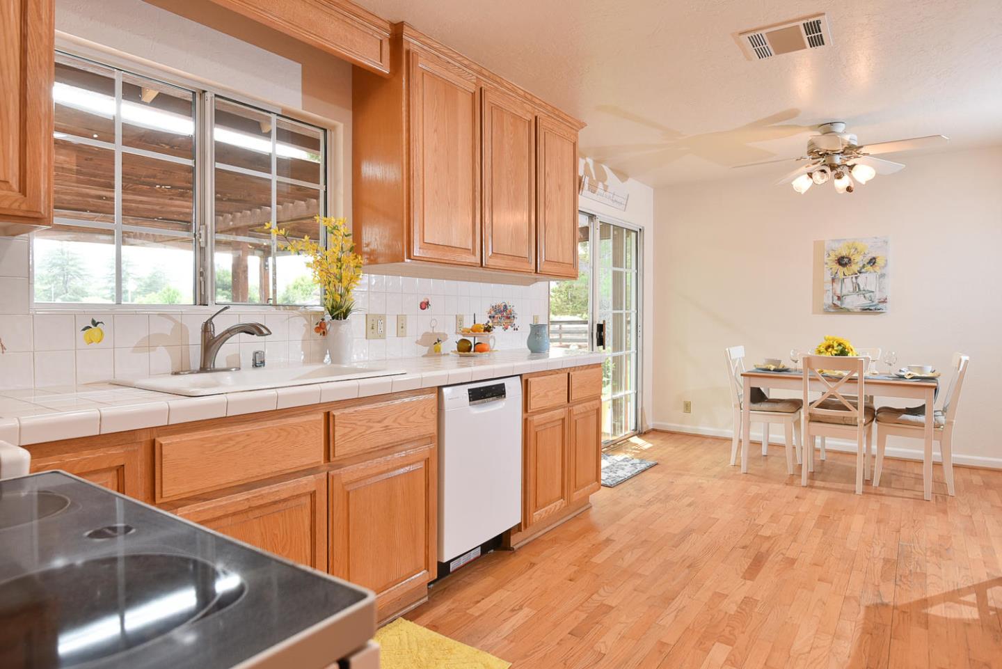 9235 Burchell Road Gilroy, CA 95020 - Photo 20 of 29 a kitchen with a sink cabinets and window