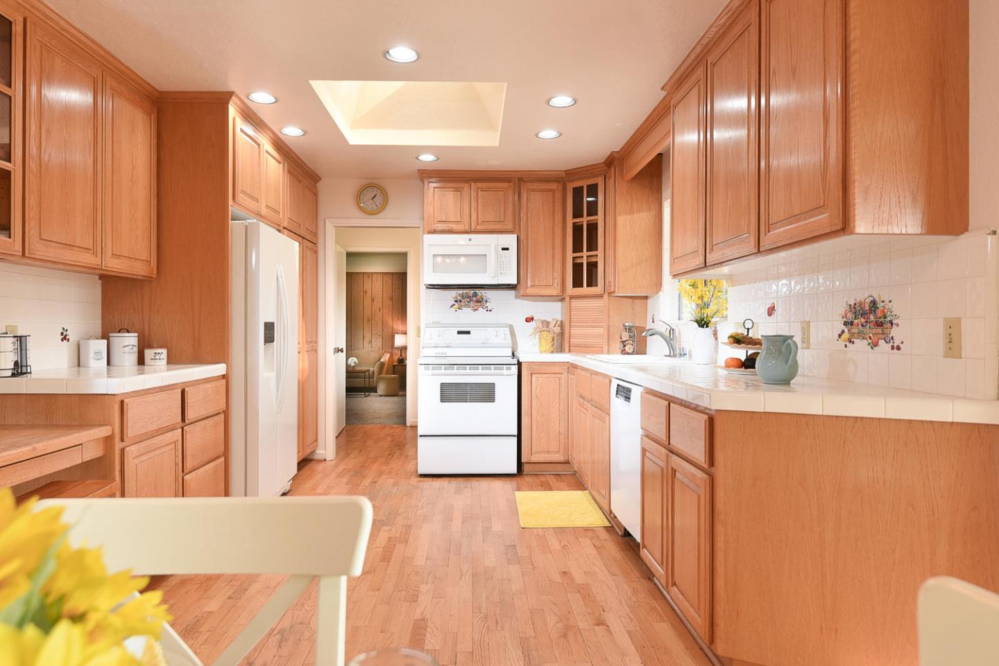 9235 Burchell Road Gilroy, CA 95020 - Photo 21 of 29 a kitchen with stainless steel appliances sink refrigerator and cabinets