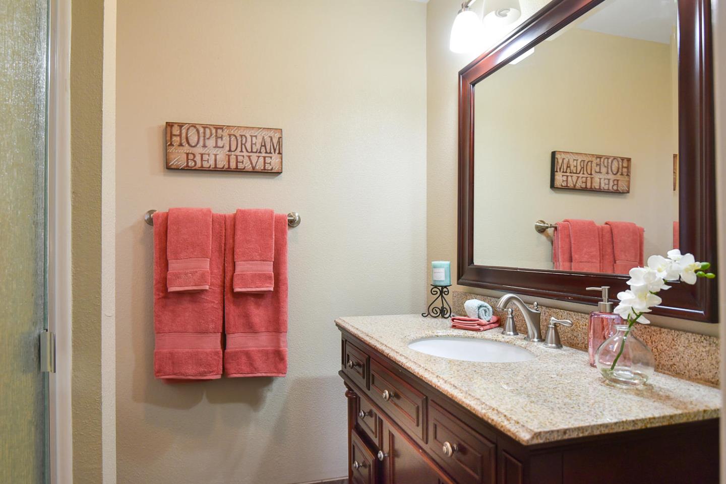 9235 Burchell Road Gilroy, CA 95020 - Photo 26 of 29 a bathroom with a sink and a mirror