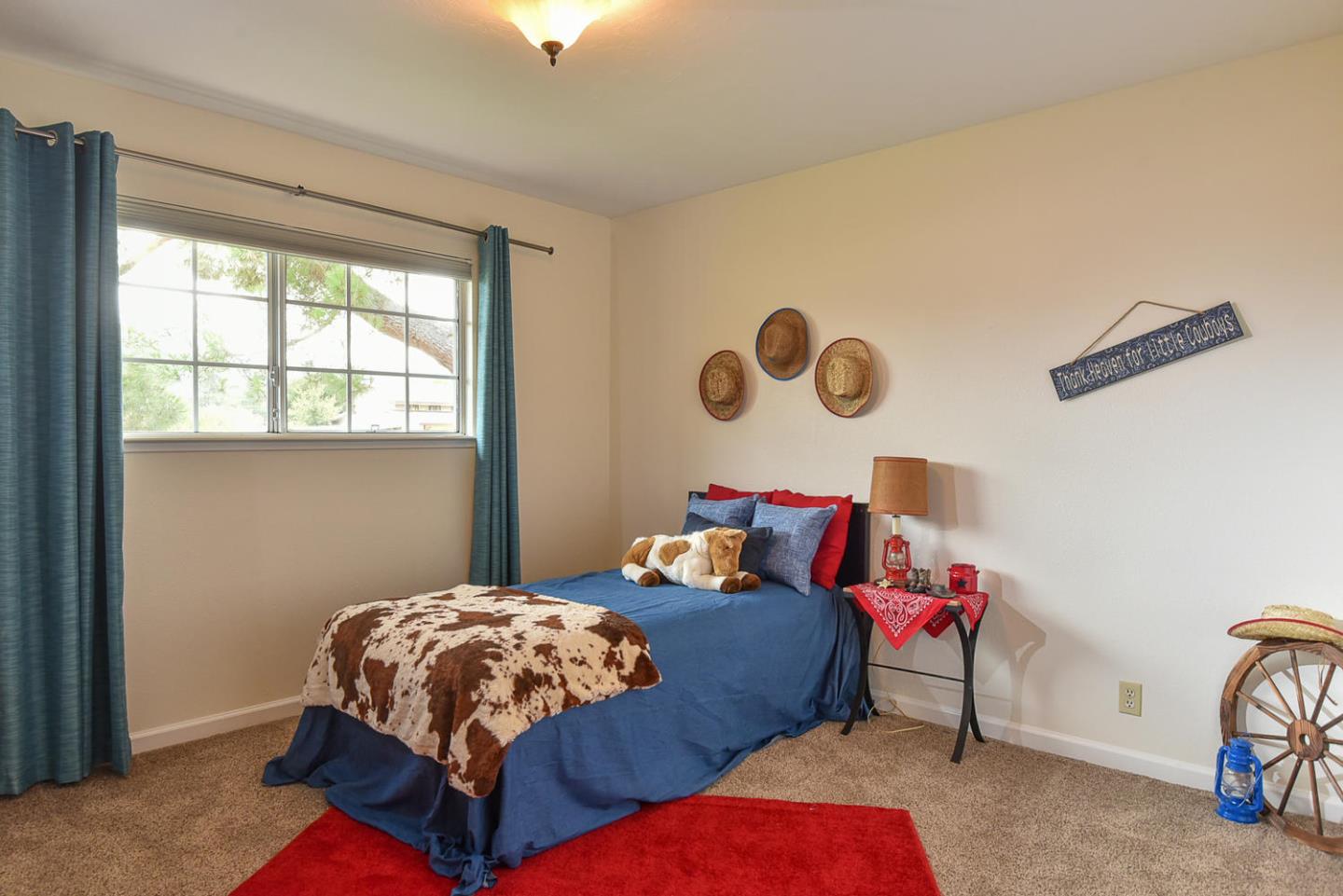 9235 Burchell Road Gilroy, CA 95020 - Photo 27 of 29 a bedroom with a bed and a dresser next to a window