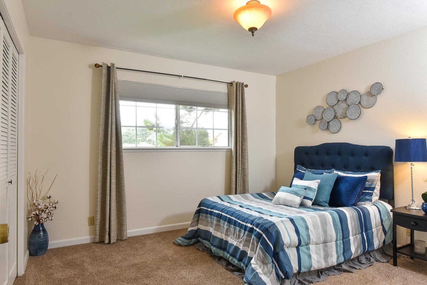 9235 Burchell Road Gilroy, CA 95020 - Photo 28 of 29 a bedroom with a bed and window
