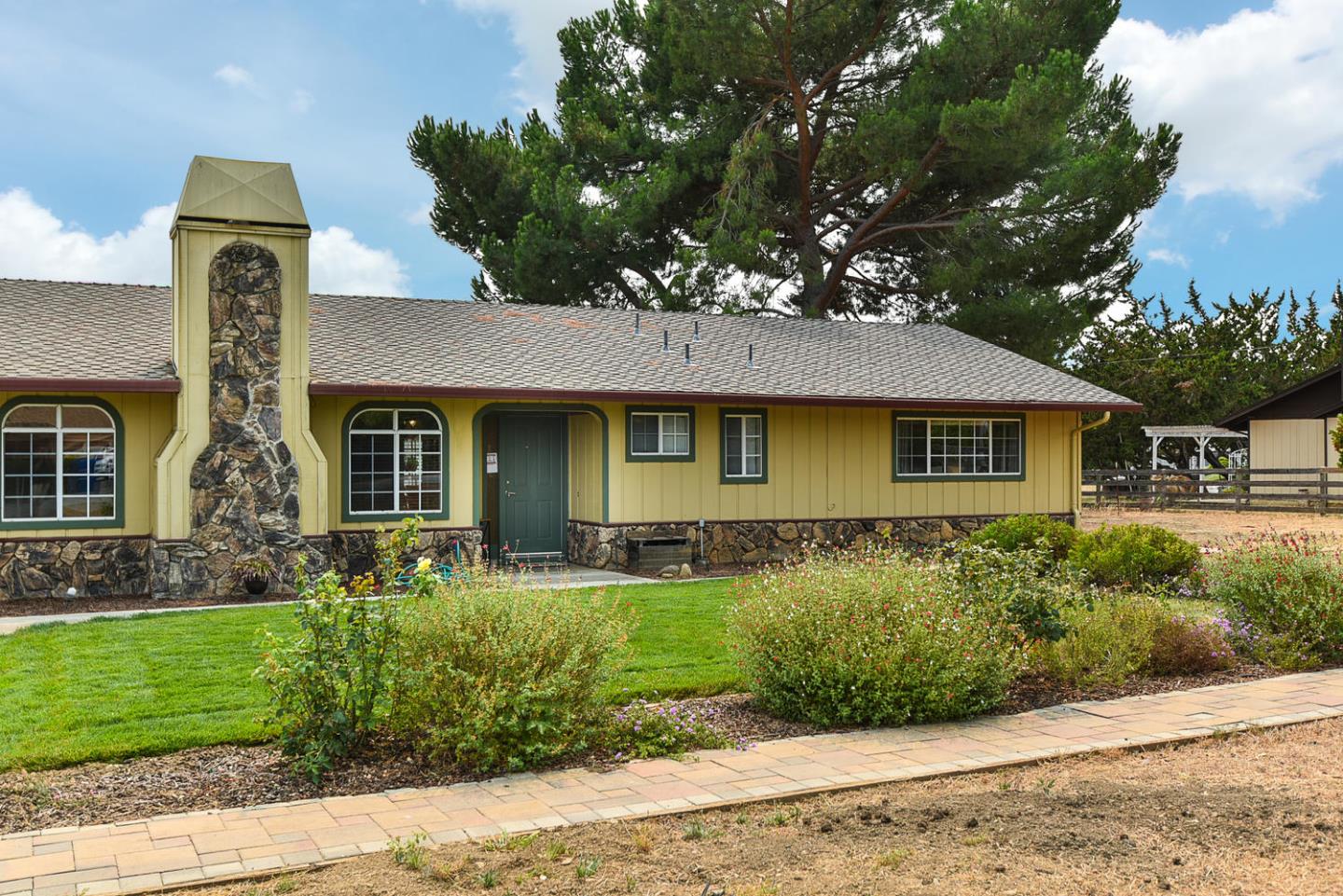 9235 Burchell Road Gilroy, CA 95020 - Photo 3 of 29 a front view of a house with garden