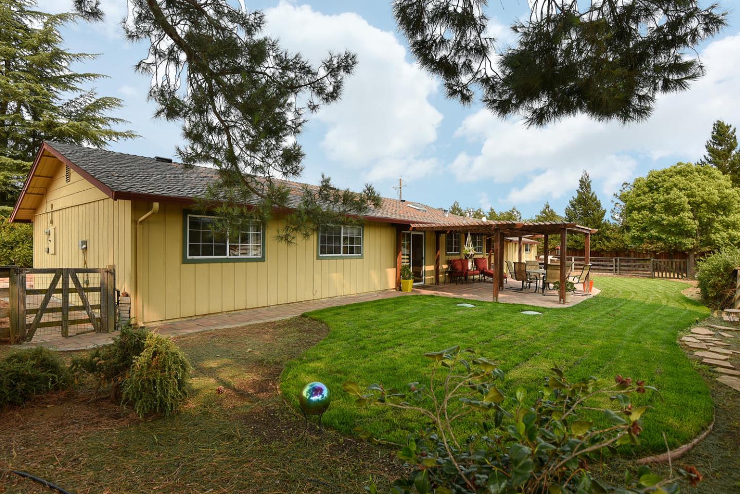 9235 Burchell Road Gilroy, CA 95020 - Photo 7 of 29 a backyard of a house with table and chairs