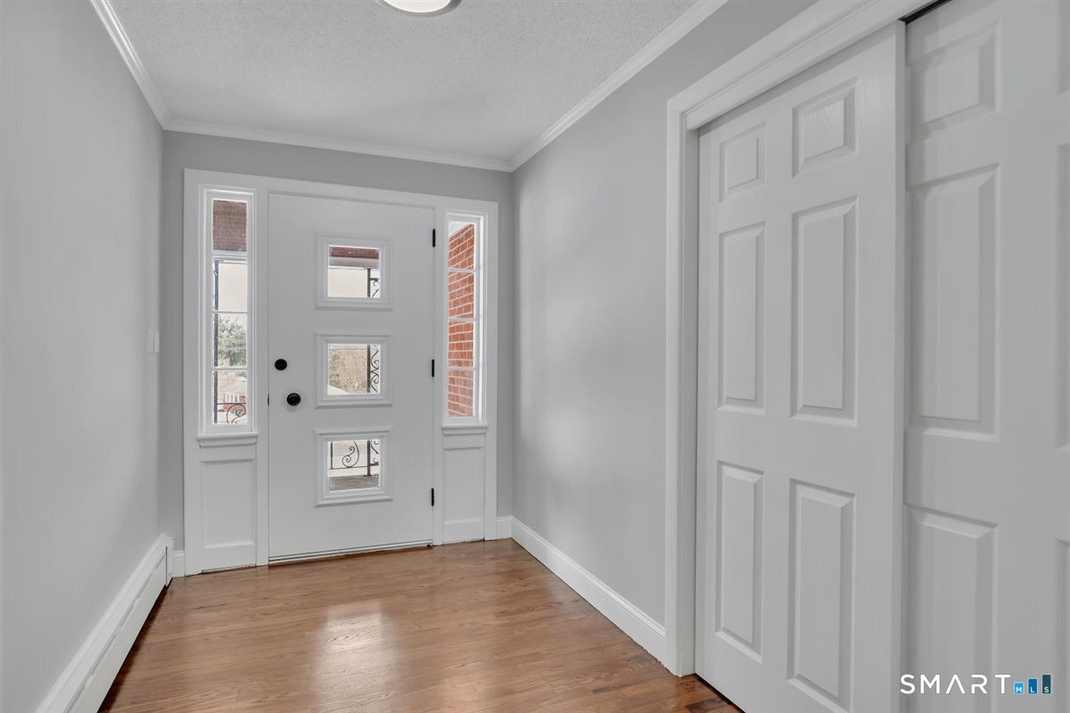 909 Randolph Road Middletown, CT 06457 - Photo 3 of 24 a view of an empty room with window and bathroom