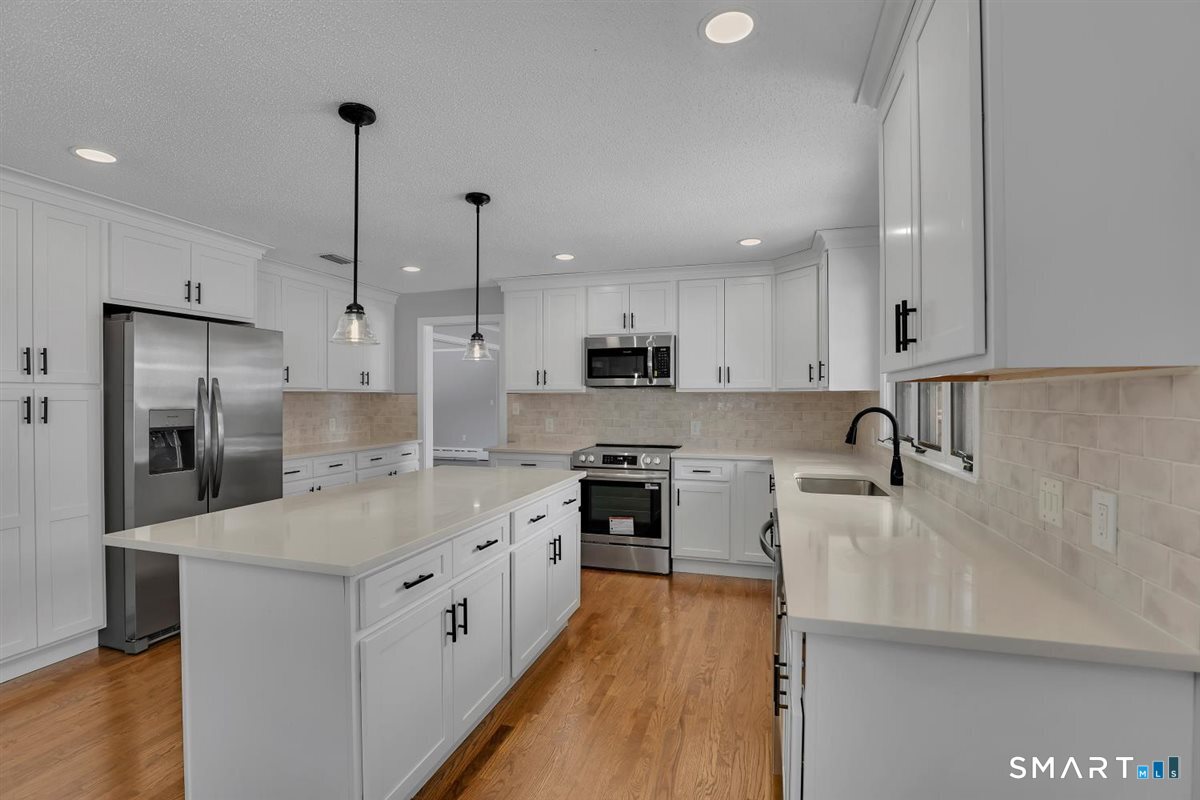 909 Randolph Road Middletown, CT 06457 - Photo 5 of 24 a large kitchen with stainless steel appliances lots of counter space sink refrigerator and cabinets