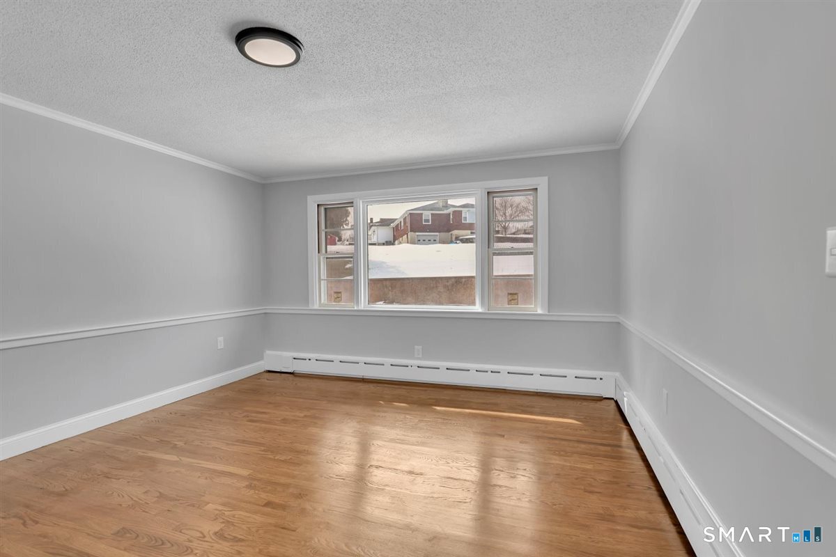 909 Randolph Road Middletown, CT 06457 - Photo 7 of 24 a view of an empty room with a window