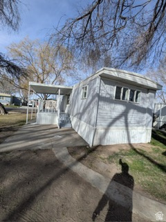 8155 South Redwood Road, Unit 96 West Jordan, UT 84088 - Photo 2 of 17 View of side of property