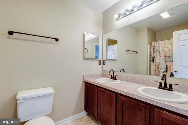 a bedroom with a bed and flat screen tv