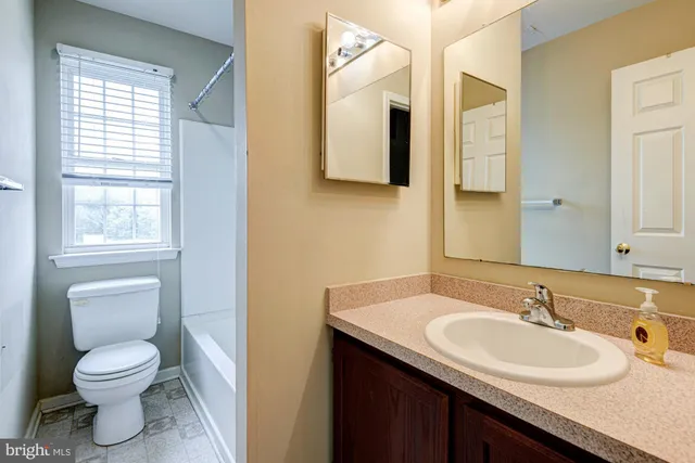 a kitchen with stainless steel appliances granite countertop a refrigerator and a stove