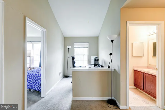 an aerial view of multiple houses with a yard