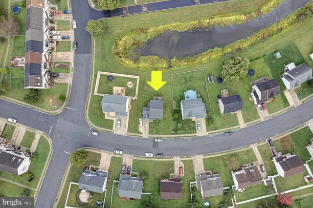 an aerial view of a house with a swimming pool