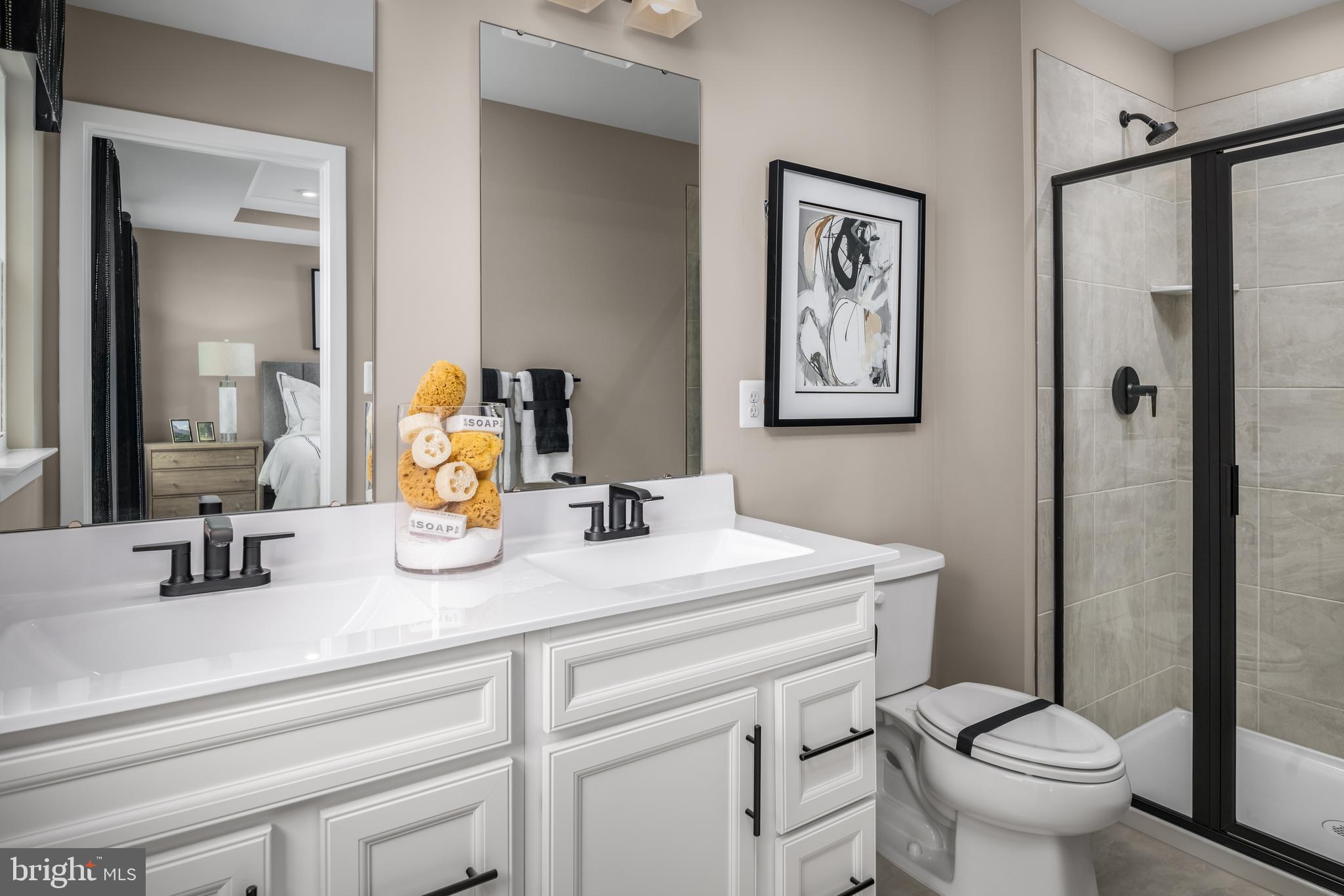 93 C Destrier Street Ranson, WV 25438 - Photo 16 of 17 a bathroom with a toilet sink and mirror