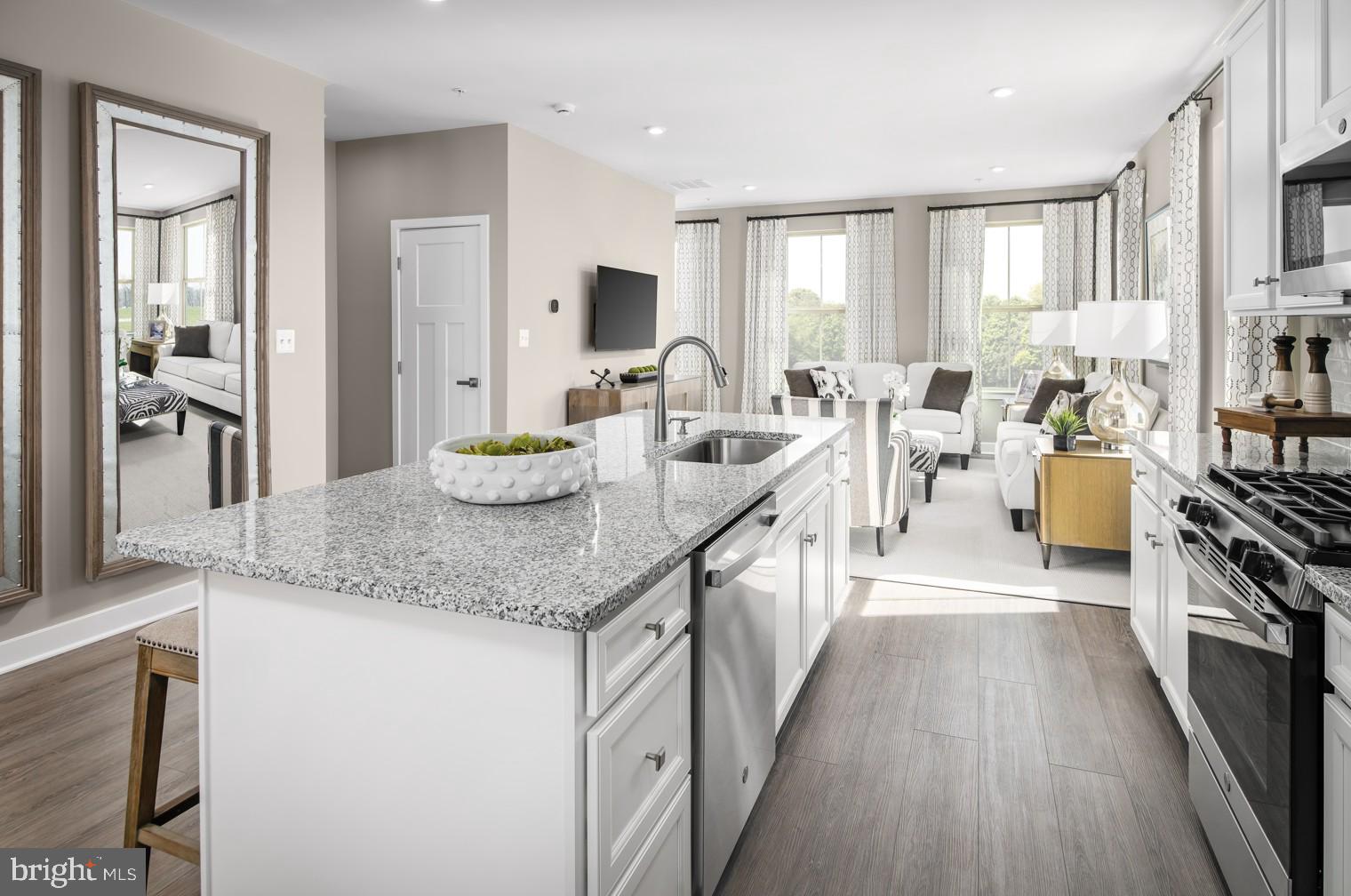 93 C Destrier Street Ranson, WV 25438 - Photo 3 of 17 a large kitchen with granite countertop a large counter top appliances and cabinets