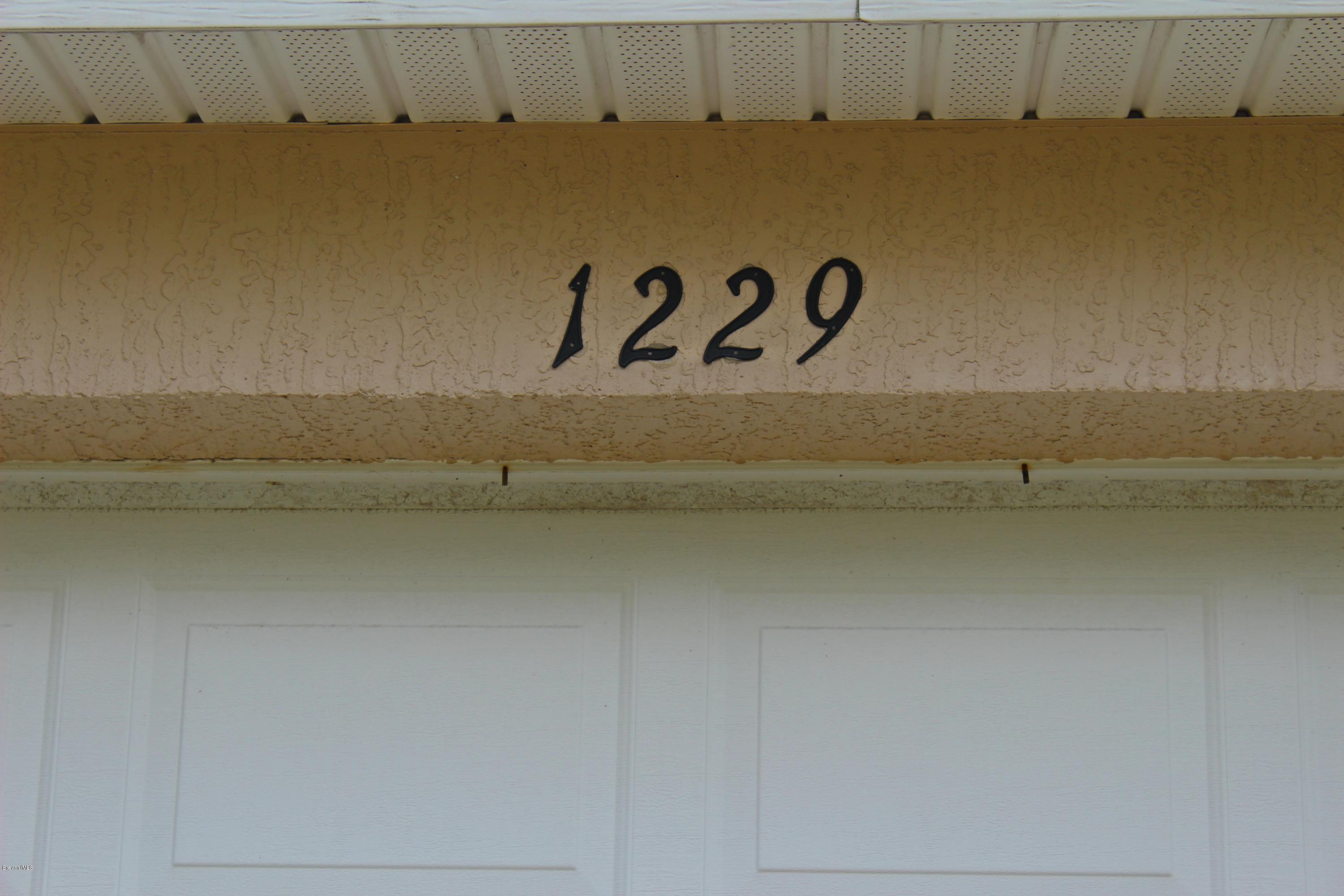 1229 Gerrity Street Southwest Palm Bay, FL 32908 - Photo 3 of 28 IMG_0799