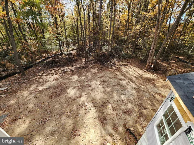 a view of a house with a snow in the yard