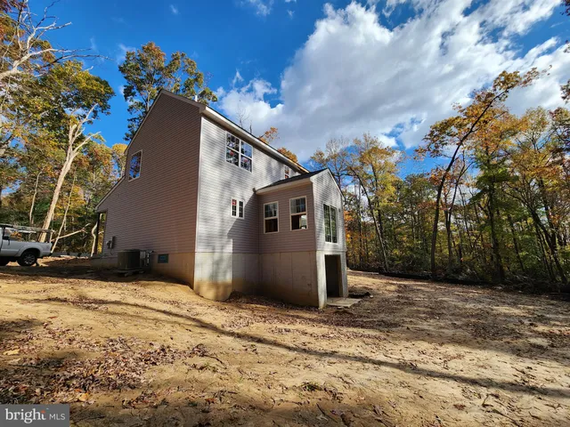 a view of a house with a tree