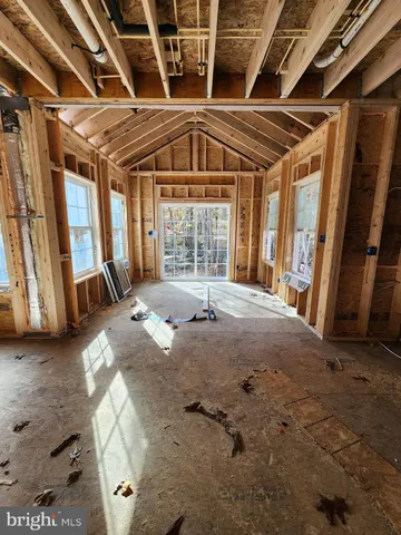 a view of an empty room with a fireplace