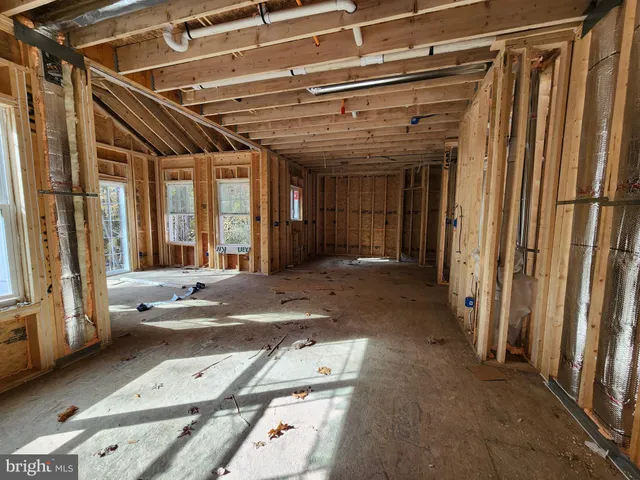 a view of a hallway with wooden walls