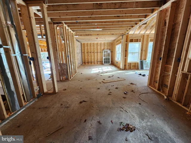 a view of an empty room with a fireplace