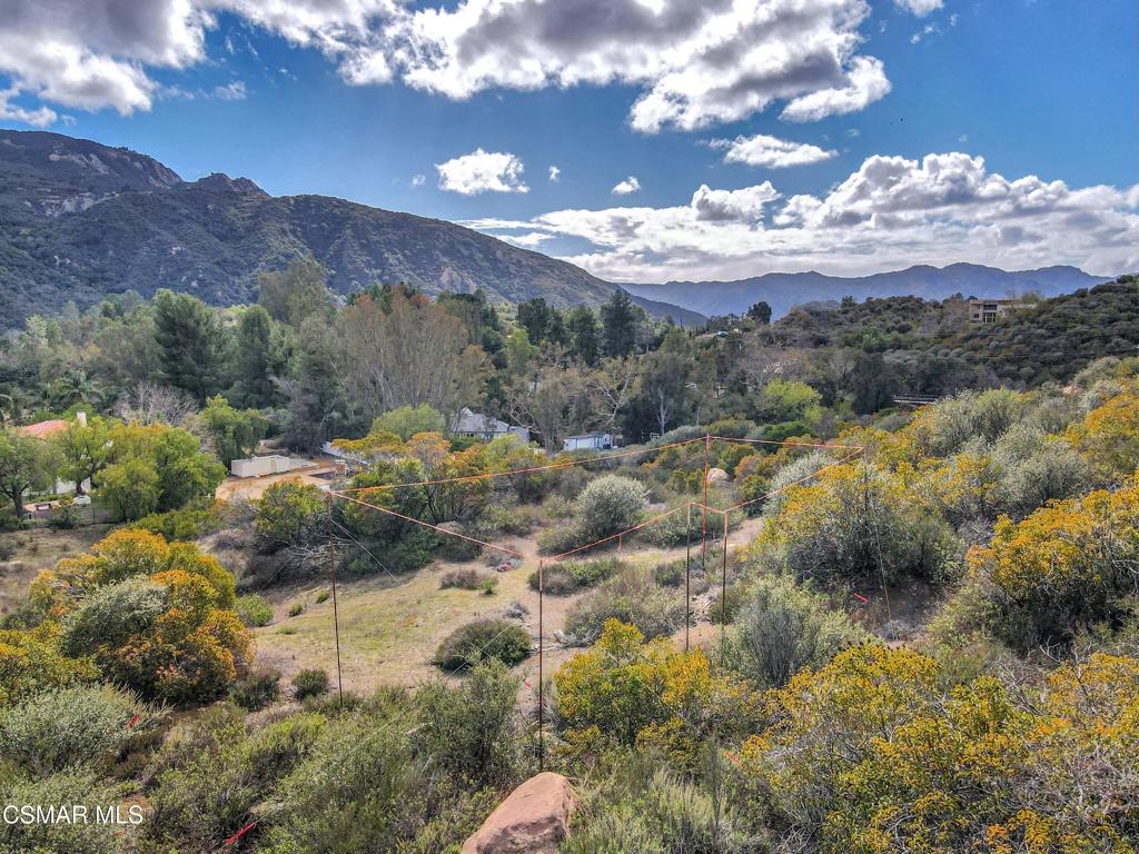 2140 Stunt Road Calabasas, CA 91302 - Photo 3 of 13 a view of a houses with mountains in the background