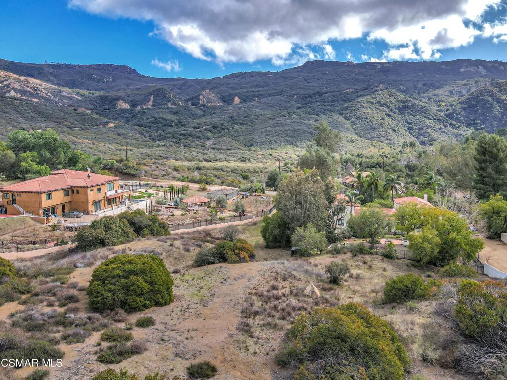 2140 Stunt Road Calabasas, CA 91302 - Photo 9 of 13 a view of a lake with mountains in the background