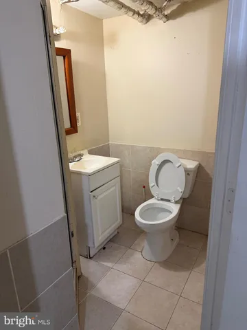 a bathroom with a sink a toilet and bathtub