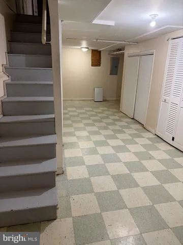 a bathroom with a toilet a sink and a mirror