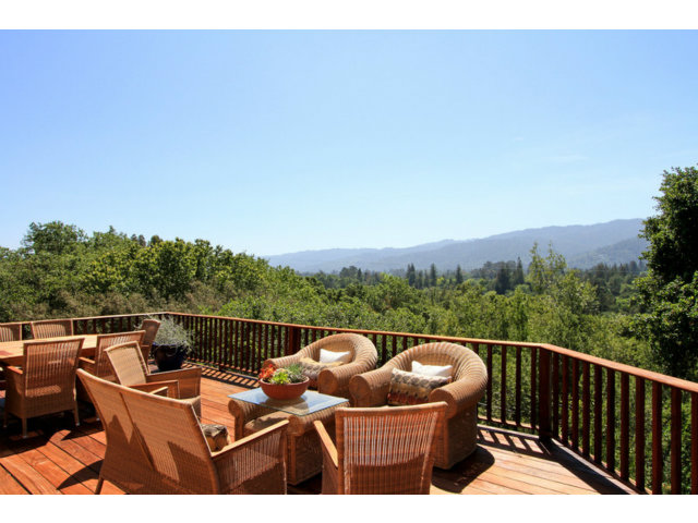 a view of a roof deck with couches