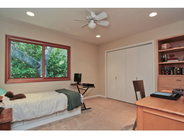 188 Alta Mesa Road Woodside, CA 94062 - Photo 14 of 25 a bedroom with a bed and a chandelier