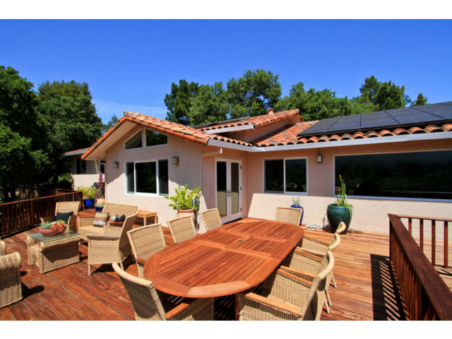 188 Alta Mesa Road Woodside, CA 94062 - Photo 20 of 25 a view of a patio with table and chairs with wooden floor and plants