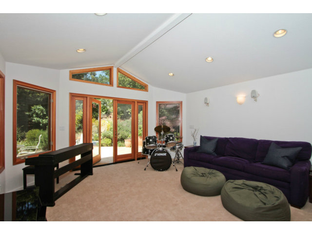 188 Alta Mesa Road Woodside, CA 94062 - Photo 8 of 25 a living room with furniture and large windows
