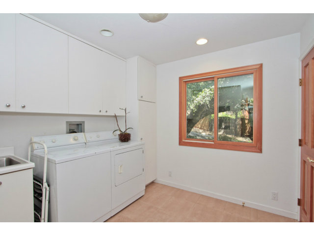 188 Alta Mesa Road Woodside, CA 94062 - Photo 9 of 25 a utility room with a sink dryer and washer