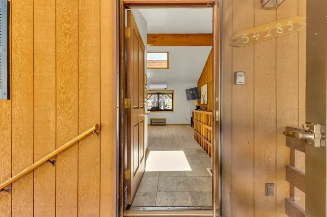 a kitchen with granite countertop a sink stainless steel appliances and cabinets