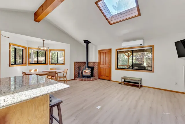 a kitchen with stainless steel appliances granite countertop a stove and a sink