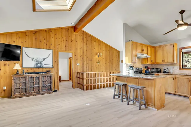a kitchen with sink and window