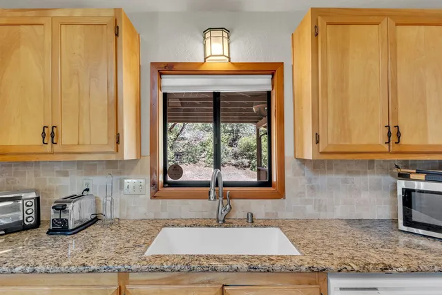a kitchen with a counter top space and a sink