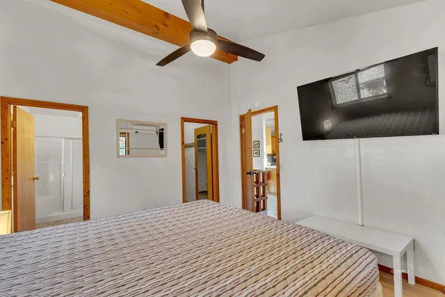 a bathroom with a shower and a toilet